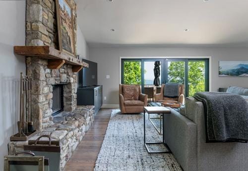 Remodeled Living space showcasing a large stone fireplace. Perfect place to gather the family and enjoy the mountains.
